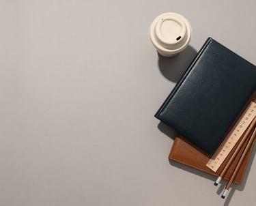 a notebook with a cup of coffee and a notebook