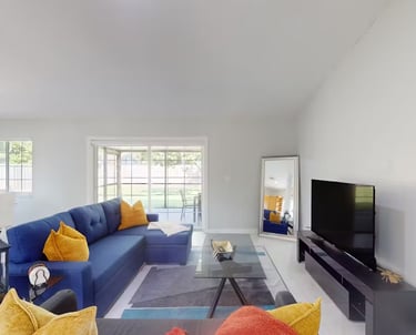 a living room with a couch and a television