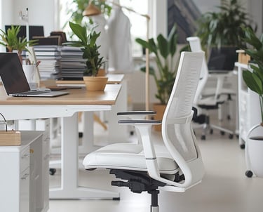 a white office chair with a laptop and a laptop