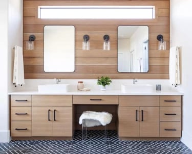 a bathroom with a wooden vanity and a mirror