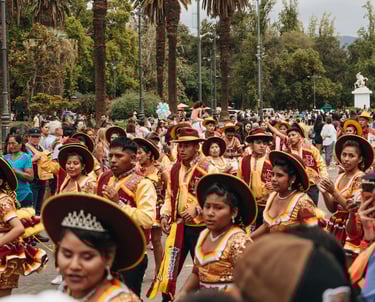 Participants in a Carnaval parade wearing traditional clothing and showing unique cultural customs