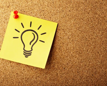 Lightbulb on a post-it, signifying an idea