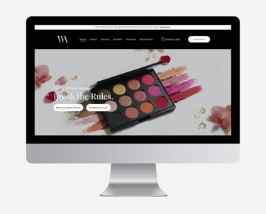 Professional makeup artist website displayed on a desktop monitor featuring a colorful eyeshadow palette.