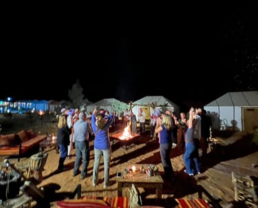 Sahara desert safari camp Morocco tours dancing in the desert