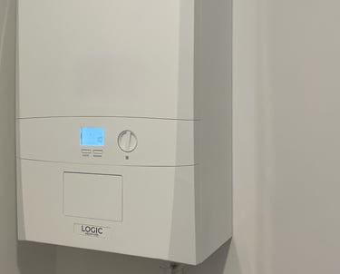 A white Ideal Logic combi boiler installed on a wall for domestic central heating and hot water.