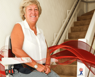 elderly woman in atlas stairlift stair elevator long island