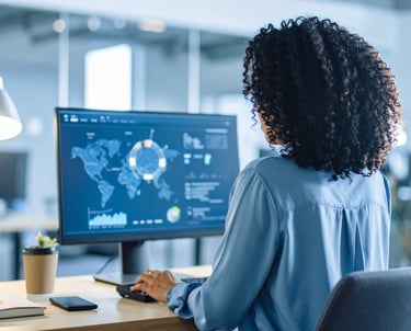 Black girl working at a desk 