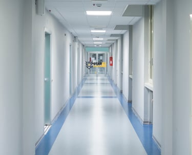 Hospital hallway with Star61 Security logo – Krankenhaussicherheit Luzern