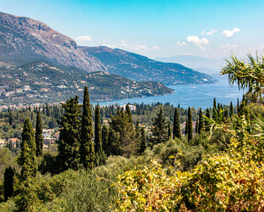 a view of a mountain range with a view of a lake and mountains