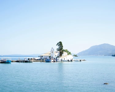 a small island with a small island in the middle of the water