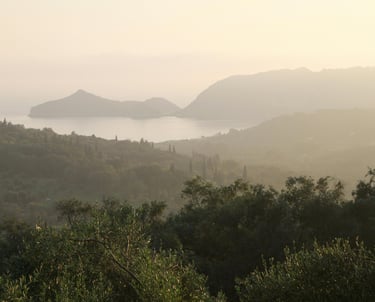 a view of a mountain range with a view of the ocean