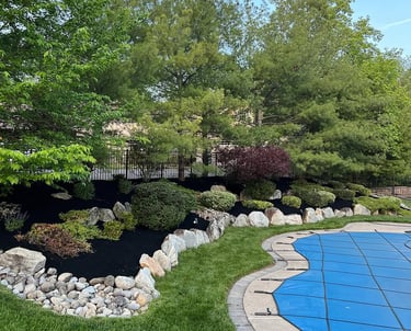 excellent landscaping and hardscaping of grass, stones and trees by NP Landscaping