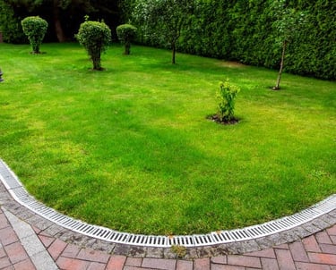 excellent landscaping and hardscaping of grass, stones and trees by NP Landscaping