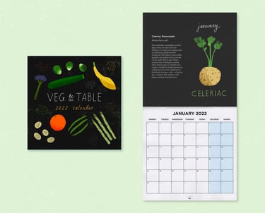 A seasonal eating calendar flat laid on a light green background.