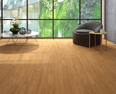 a wooden flooring living room with a chair and a table