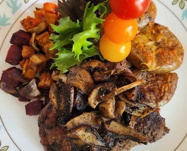 beautiful plated meal steak, salad, roasted root veg, cherry tomato skewer