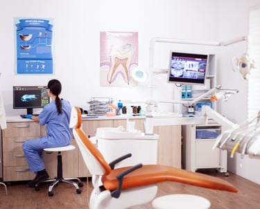 a woman in a chair in a dental room