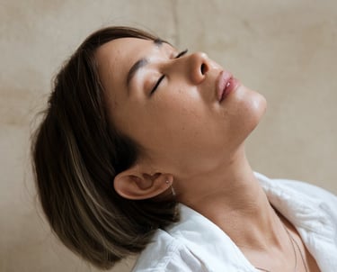 a woman doing face yoga