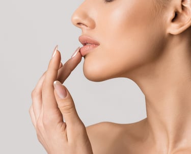 a woman touching her lip