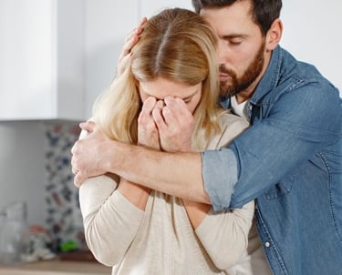 man consoling wife