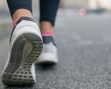 a person walking on a sidewalk 