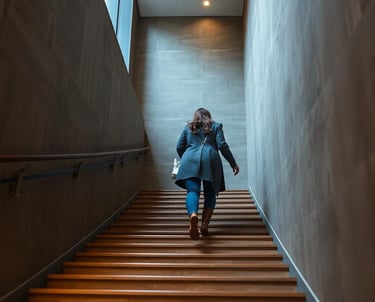 a woman walking up a flight of stairs