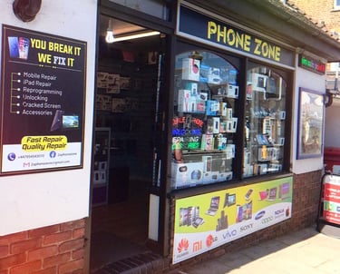 Phone Zone mobile repair shop storefront offering cracked screen and iPad repair services.