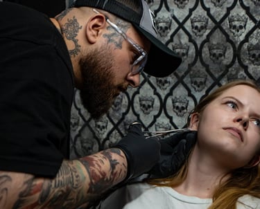 Allen doing an ear piercing