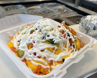 Super Nachos of food that is sitting on a counter
