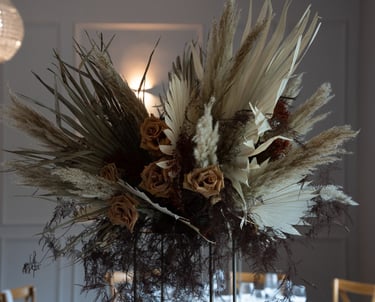 a vase with dried flowers in a vase wedding design
