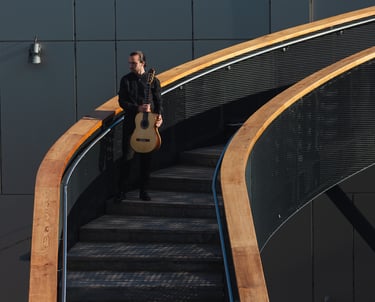 Classical Guitarist Filip Babic standing on stairs outside