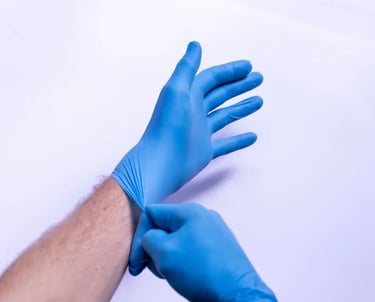A person wearing a pair of gloves.