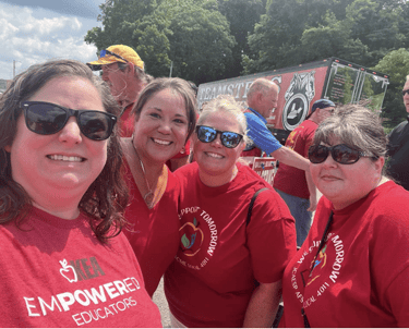 4 women in red "Empowered Educators" tshirts on