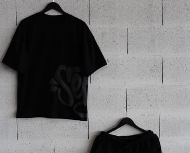 a black and white shirt and shorts with a black and white shirt