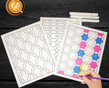 One of 3 coloring pages being colored on a wood table, surrounded by markers and a cup of cocoa.