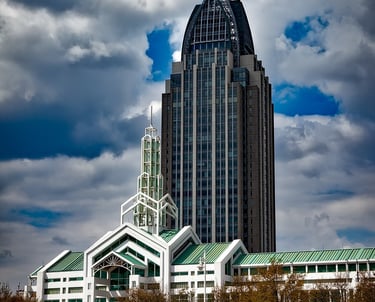 a large building with a clock tower in the background