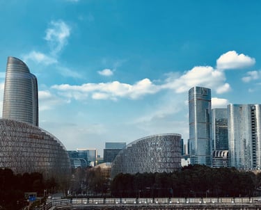 a city skyline with skyscrapers and a river