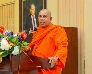 a monk in a red robe and a microphone