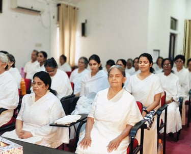 a group of people sitting in chairs in a room