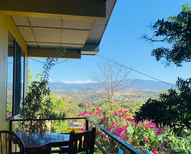 a table with a table and chairs on a balcony