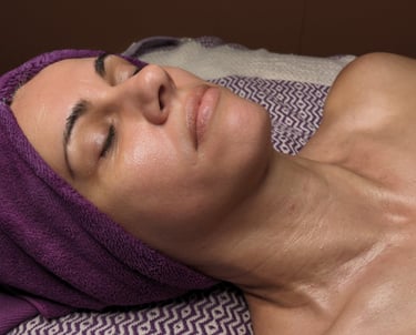 woman getting a facial at a spa