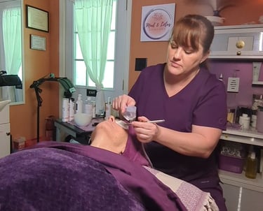 licensed esthetician performing oxygen infusion facial on client