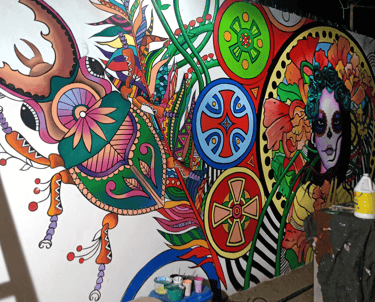 a large mural of a woman's face and a insects
