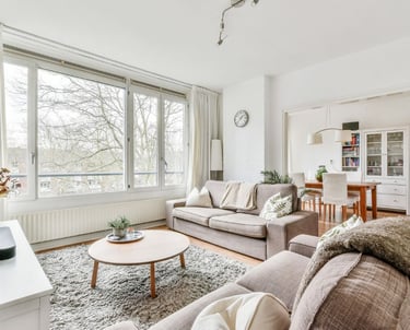 Living room that has been cleaned with a vacuumed rug and dusted