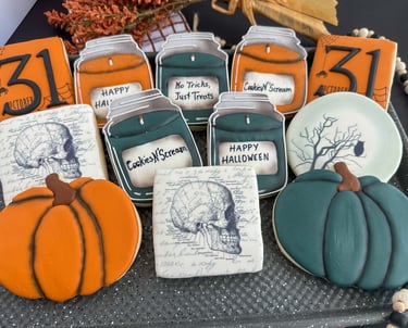 a tray of cookies decorated with halloween decorations