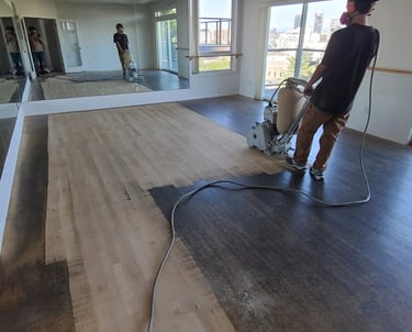 a maple floor that has been heavily damaged by tap dance shoes