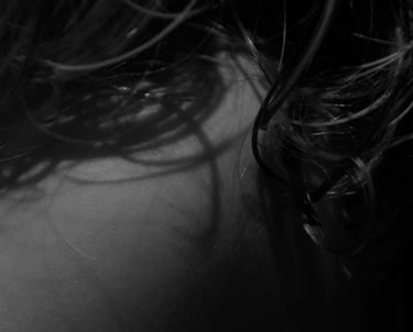 a girl with some hair on her neck