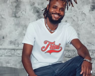 Man wearing a tshirt with the word Trini on the chest