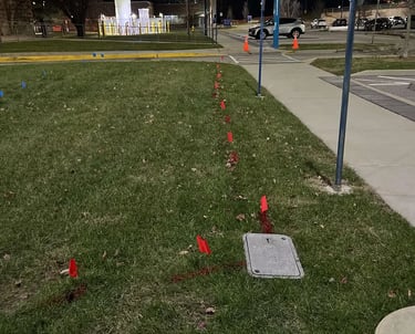 Power line marking leading to a utility box