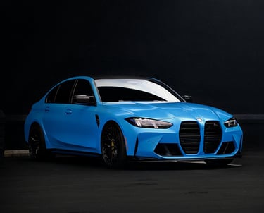 Electric blue BMW M3 Competition XDrive car photography at 704 Exotics in Charlotte, North Carolina.